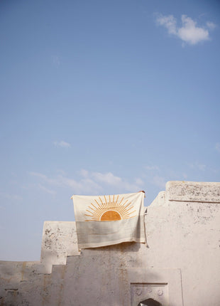 Powered By People Rising Sun Linen Throw