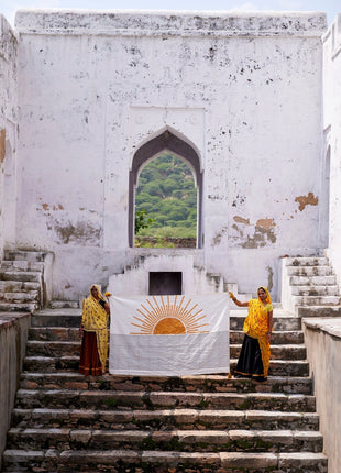 Powered By People Rising Sun Linen Throw